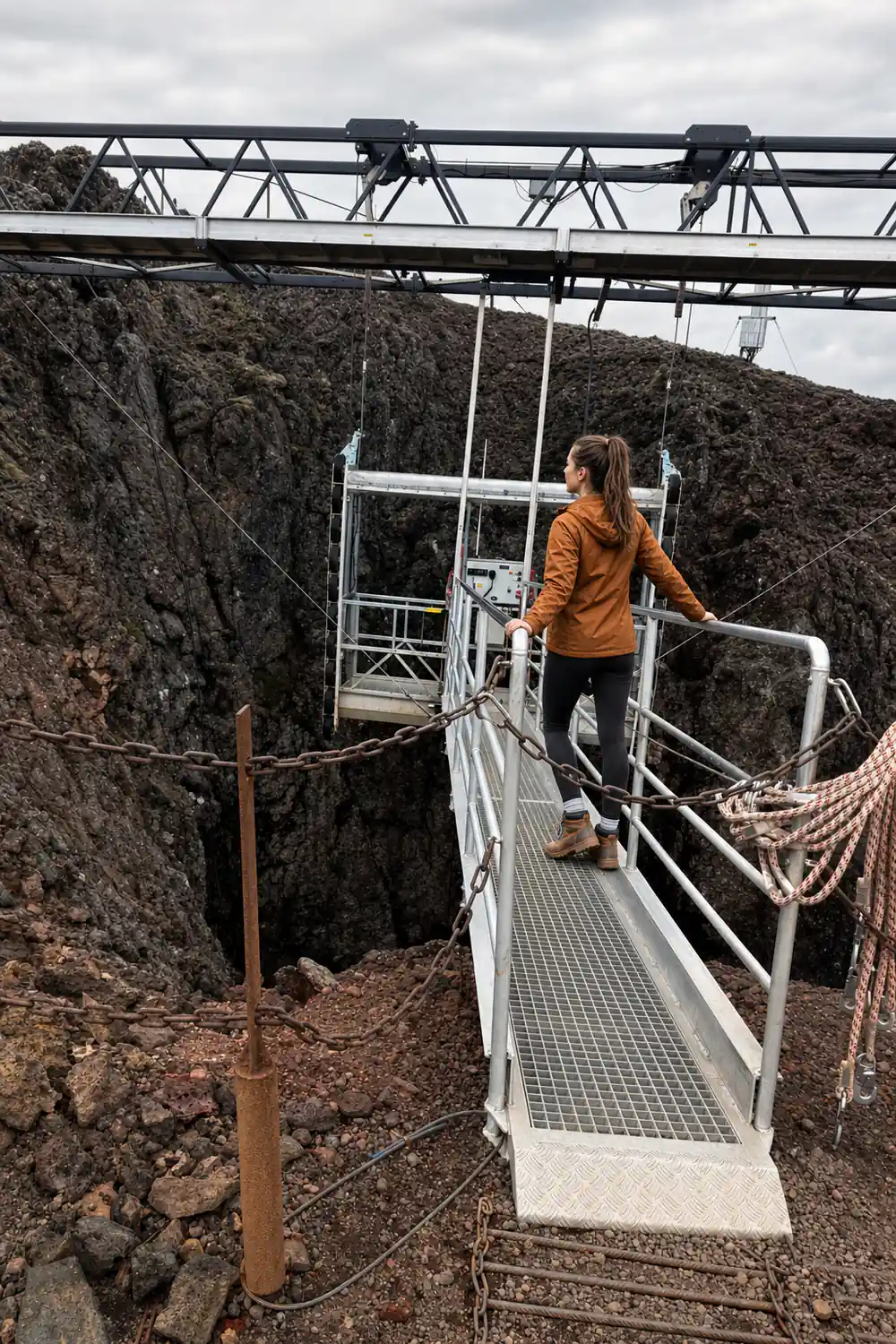 The lift platform parked at the crater mouth in daylight