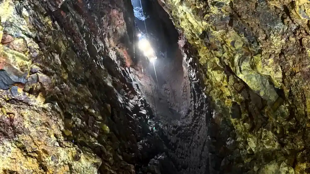 The narrow upper shaft with a single lamp burning in it